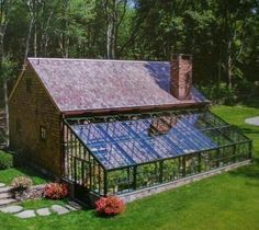 an aerial view of a house with a greenhouse