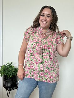 Product Description: Introducing the Bella Floral Blouse featuring a self-tie tassel neck and the beautiful colors of spring, pink and green. Lightweight for optimal comfort as the weather warms up and pairs perfectly with any bottoms you choose. We love this blouse because it is easily dressed down with denim or up with dress pants, a skirt and would look amazing paired with white!! Elevate your wardrobe with this beautiful piece, we know you won't regret it! Quick Product Details and Features: Spring Beach Tie Neck Tops, Spring Tie Neck Top For Beach, Spring V-neck Blouse With Tassel Ties, Spring Beach Blouse With Tie Neck, Spring Tie Neck Blouse For The Beach, Tie Neck Blouse For Beach And Spring, Casual Multicolor Tie Neck Tops, Casual Tie Neck Top For Vacation, Casual Vacation Blouse With Tassel Ties