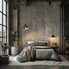 a bedroom with concrete walls and flooring is pictured in this image, there are two lamps on either side of the bed