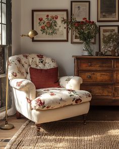 a living room filled with furniture and pictures on the wall