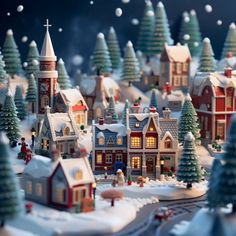 a christmas village with houses and trees covered in snow