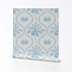 a blue and white napkin with palm trees on it