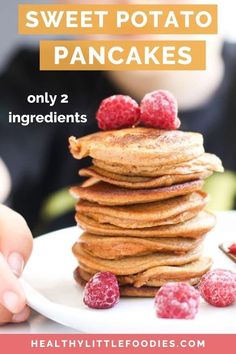 a stack of pancakes with raspberries on top and the words sweet potato pancakes