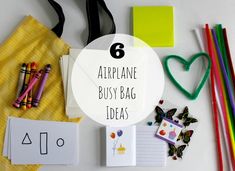 the contents of an airplane busy bag are laid out on a table with markers, pencils and paper