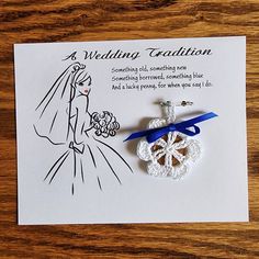 a wedding congratulations card with a snowflake ornament and ribbon attached to it