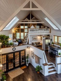 an open floor plan with stairs leading up to the loft