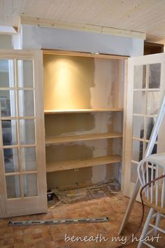 the room is being remodeled and ready to be used as a storage area for furniture