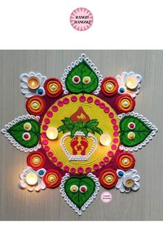 decorative diya with candles on the wall