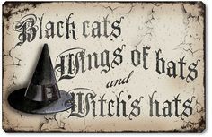 an old fashioned sign with a witches hat on it's front and back side