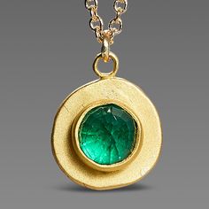 Evoking both modern and ancient energies, a luscious rose cut emerald is wrapped in warm 22k gold, set on a hammered 22k gold disk, and suspended from a delicate 14k gold chain. Simple and so elegant. Pendant measures approximately 3/8 inch in diameter. Matte finish. Apoxie Sculpt, Beautiful Pendants, Silver Gold Jewelry, Visual Board, Emerald Pendant, Green Style