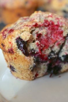 a close up of a muffin on a plate