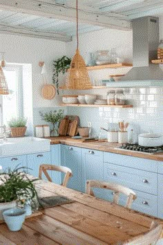 a kitchen with blue cabinets and wooden tables