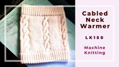 the cabled neck warmer is knitted and ready to be used in knitting projects