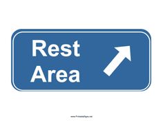 a blue rest area sign with an arrow pointing to the right