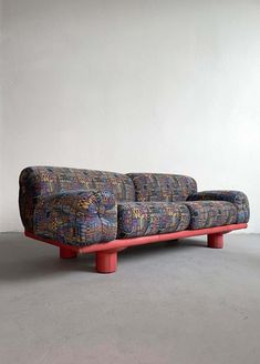 For Sale on 1stDibs - Very rare sofa designed by Carlo Bartoli for Rossi di Albizzate. Produced in the 1980s postmodern era. This extremely comfortable sofa features a wooden Patterned Sofas, 80s Sofa, 80s Couch, Carlo Bartoli, Couch Pattern, Punk Academia, Stone Sofa, Italian Sofa Designs, Mid Century Bar Stools