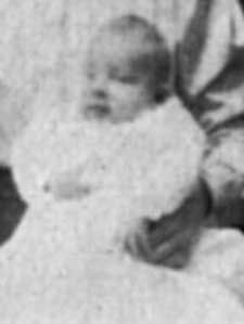 an old black and white photo of a baby