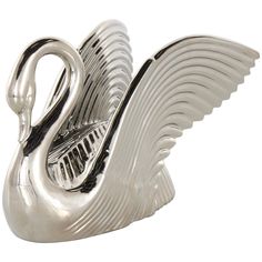 a silver swan sculpture sitting on top of a table