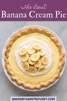 the best banana cream pie with whipped cream and sliced bananas on top in a white plate