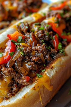 two hot dogs with toppings sitting on a plate