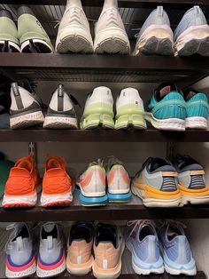 there are many different shoes on the shelves