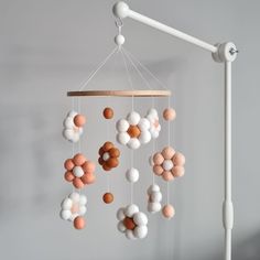 a mobile with balls hanging from it's sides