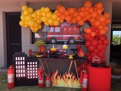 a fire truck themed birthday party with balloons