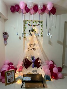 a birthday party with balloons and decorations