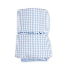 a blue and white gingham pillow on a white background