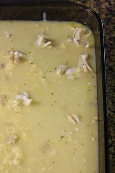 a casserole dish with chicken and cheese in it on a counter top, ready to be eaten