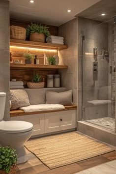 a bathroom with a toilet, sink and shower stall in it's own area