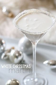 White Christmas Martini 2 ounces vanilla vodka 2 ounce white chocolate liqueur 1 ounce white creme de cacao 1 ounce half-and-half Coat rim of glass in honey; then dip the rim in sugar. In a cocktail shaker filled with ice, add the vodka, white chocolate liqueur, creme de cacao and half-and-half. Shake vigorously and strain into the prepared martini glass. White Christmas Martini, Christmas Martini, White Chocolate Liqueur, Chocolate Liqueur, Vanilla Vodka, A White Christmas