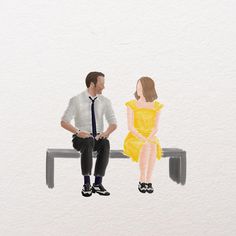 a man and woman sitting on a bench next to each other