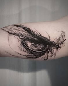 an eye tattoo on the arm with lines coming out of it's irise