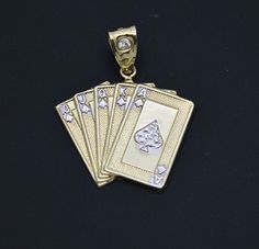 Our Real 10K Yellow White Gold Poker Playing Cards Faces Card Pendant 3.1 gram is designed for everyday wear and goes with all styles. It is so dainty, elegant and versatile for all special occasions. This pendant suits perfectly for formal style and goes well with suits. Get your today! Specifications: Metal: Real 10K Solid Yellow Gold (Stamped, 10K) Condition: Brand New Finish Polished Weight: 3.1 grams Wide:  1.12 inch Height: 1.35 inch Men Jewelry, Formal Style, Jewelry Pendant, Simply Beautiful, Solid Yellow, 10k Gold, Gold Pendant, Pendant Jewelry, Poker