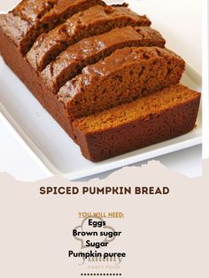 sliced pumpkin bread on a white plate with the words spiced pumpkin bread above it