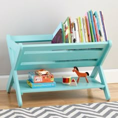 the book caddy is blue and has books on it