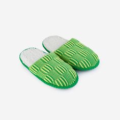 A plush, colorful take on your favorite spa-style house slippers. Backless slide slippers knit with a two-tone chunky checkerboard pattern. Fully fleece-lined with slip-resistant padded soles. Sizes S/M (Womens 6-9, Mens 5-7.5)L/XL (Womens 9.5-12.5, Mens 8-11) Details Body – 100% Soft AcrylicLining - Polyester FleeceFoam cushioned sole with slip resistant patchesHand wash, dry flat away from heat. Bar Apron, Hair Necklace, Spa Style, Candle Wrap, Cocktail Book, Slide Slippers, Print Calendar, Back Bag, Eye Pillows