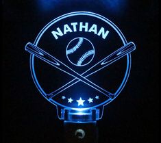 a baseball bat and ball illuminated sign in the dark