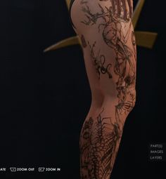 a woman with tattoos on her legs and body is posing for the camera in front of a black background