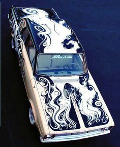 an old car painted with black and white designs