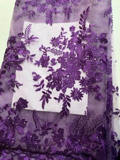 purple lace with flowers and leaves on it