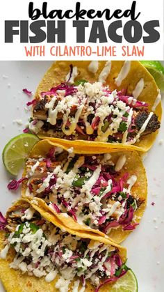 three fish tacos with cilantro - lime slaw on a white plate