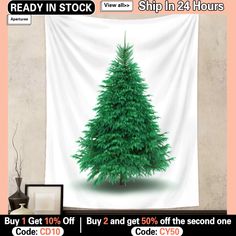 a green christmas tree sitting in front of a white curtain with the words ready in stock