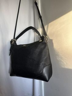 Authentic Coach Ivie Black Pebbled Leather Hobo Handbag Purse 35846 Bag Very Good condition note the long strap is a non Coach replacement. Also hardware rings has some wear on it. Clean and Sanitzed Material Leather Color Black Hardware gold tone Closure Zipper Exterior Back Zipper Pocket Interior Fabric lining with one slip pocket 13" L x 11" x 3.5" Strap Drop 9" Coach Leather Hobo Bag With Zipper Closure, Coach Hobo Shoulder Bag With Zipper Closure, Black Hobo Shoulder Bag With Zipper Closure, Black Hobo Bag With Gold-tone Hardware, Coach Black Hobo Bag With Gold-tone Hardware, Leather Hobo Handbags, Hobo Handbag, Black Pebbles, Top Handle Bags