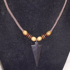 Handcrafted Native American Necklace "Crafted one of a kind"  Leather necklace,   with wood and silver beads and 3/4" X 1 1/2"  Hematite spear point Pendant. Silver lobster clasp  19"lg. "MADE IN THE RIDGES OF EAST TENNESSEE, USA" Mens Native American Jewelry, Native American Inspired Fashion, Indian American, Native American Necklace, Art Jewelry Design, Fashion Moodboard, East Tennessee, Native Jewelry, Necklace Craft