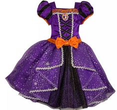 a purple and black dress with an orange bow