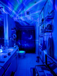 a bathroom with blue lights on the ceiling