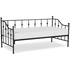 a black metal bed frame with white sheets