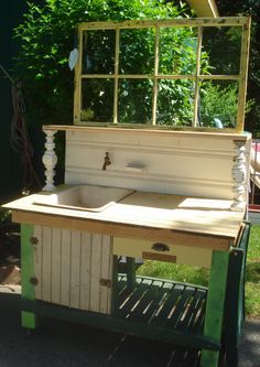 an old fashioned sink is painted green and white