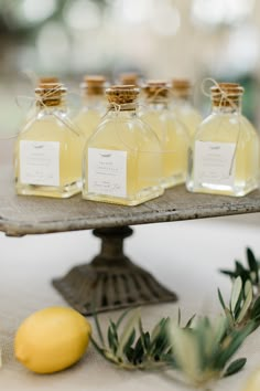 four bottles of lemonade sit on a tray